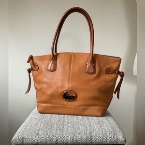 Dooney and Bourke Tan Tote with Tortise Shell resin emblem